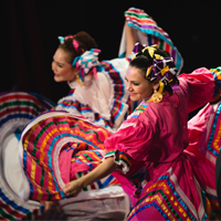 Award recipients performing latin american folk dance 